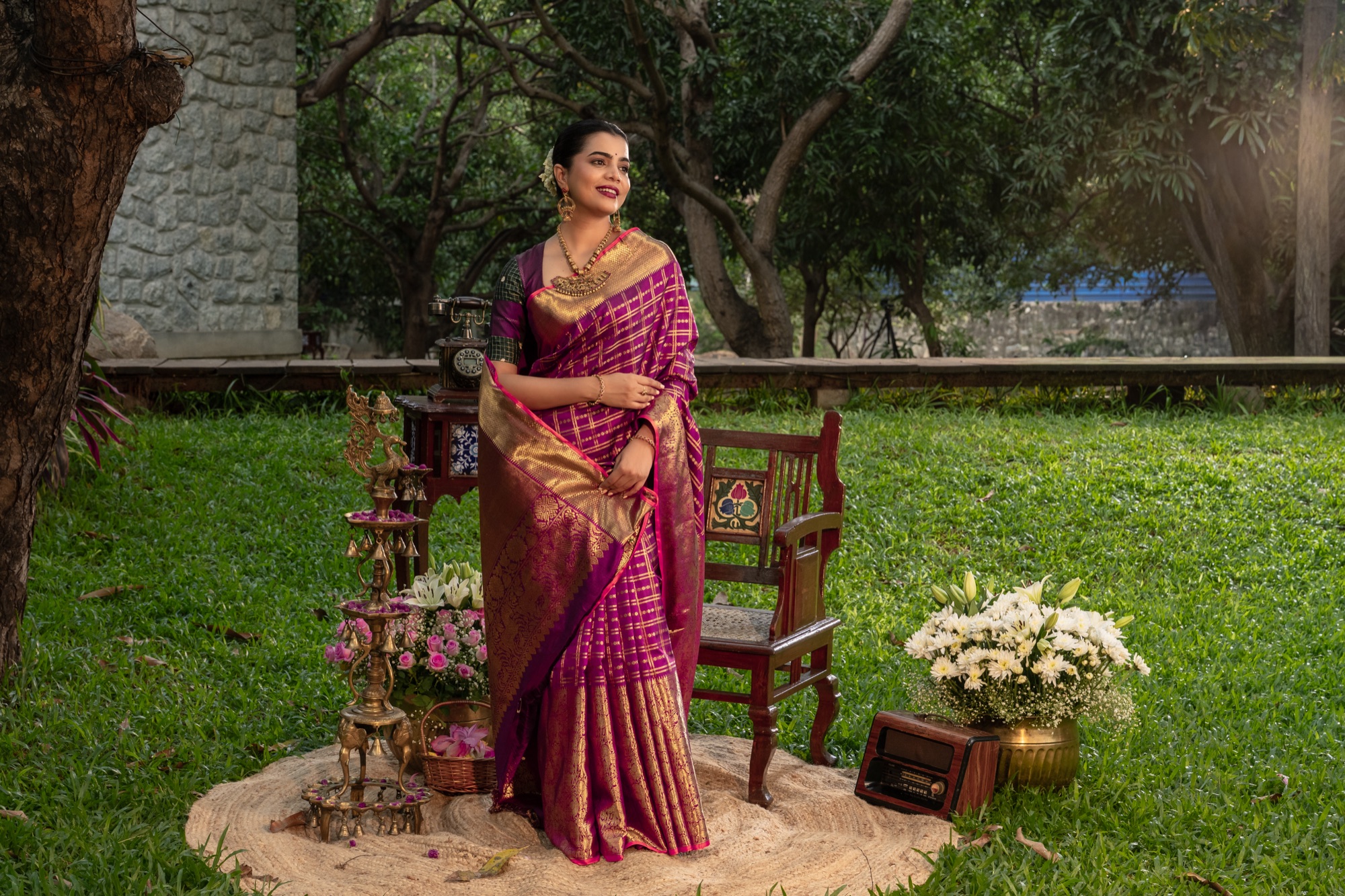Magenta and Gold Kanchivaram Silk Saree in a Heritage Setting